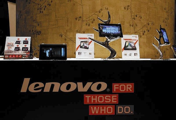 Lenovo tablets and mobile phones are displayed during a news conference on the company's annual results in Hong Kong