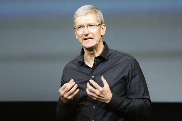 Apple Inc CEO Tim Cook speaks from the stage during Apple Inc's media event in Cupertino