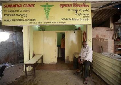 A patient waits outside a doctor's clinic in Mumbai