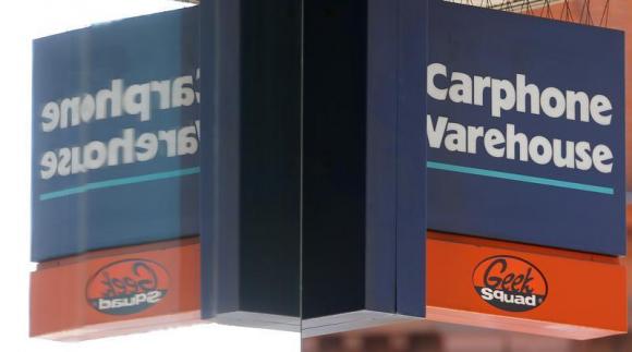 A sign is seen outside the Carphone Warehouse's store on Oxford Street in central London