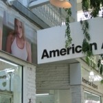American Apparel reports wider losses