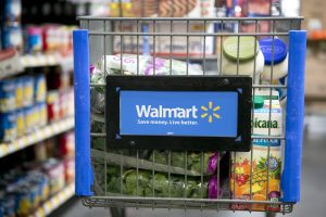 Grocery items sit inside a cart at a Wal-Mart store in Alexandria, Virginia, U.S., on Wednesday, Nov. 14, 2012. Wal-Mart Stores Inc. is scheduled to release earnings data on Nov. 15. Photographer: Andrew Harrer/Bloomberg via Getty Images